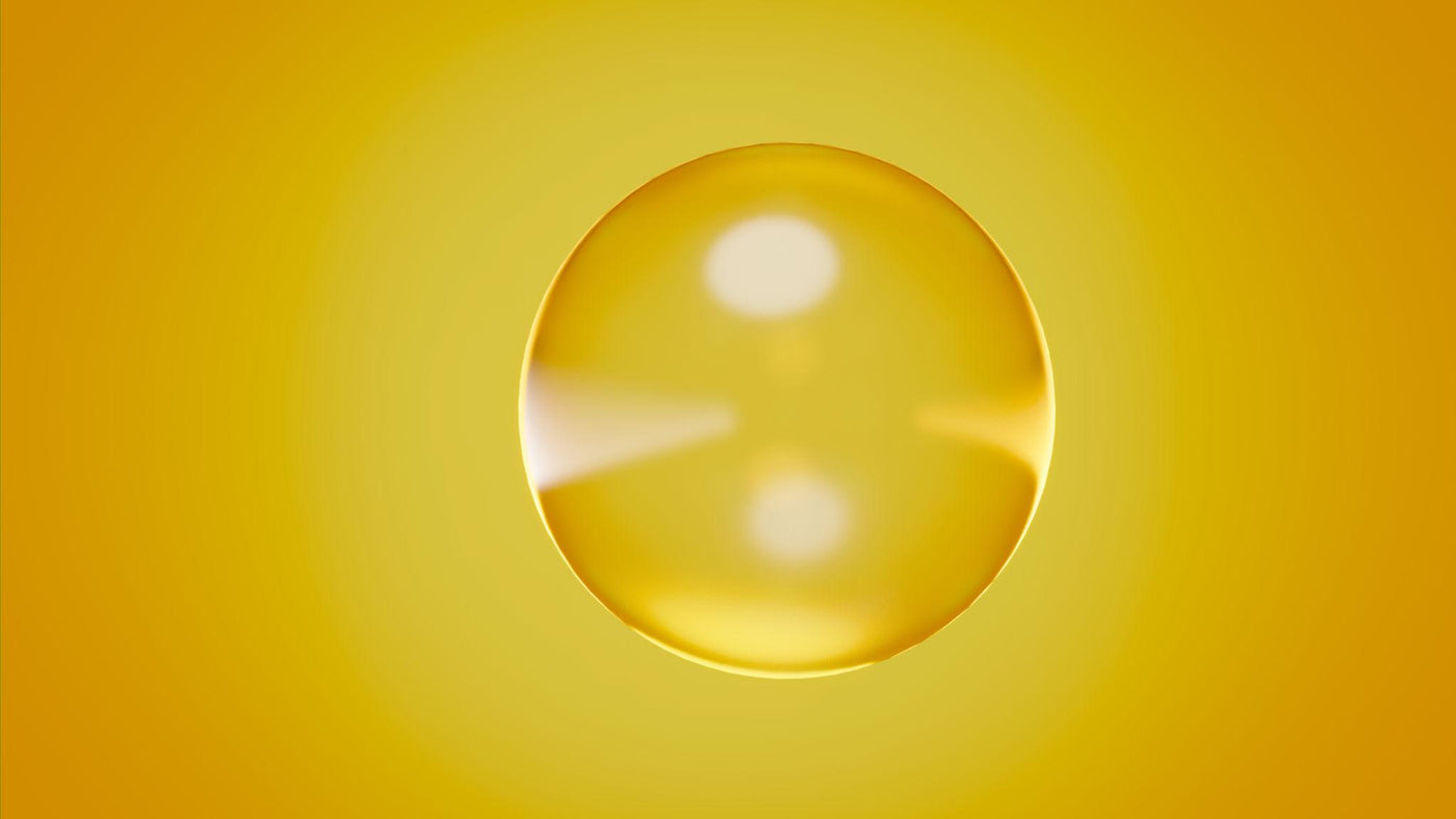 Visuel de la page Nos Exclusions Inura illustrant un sérum cosmétique, avec texture jaune brillante et bulle lumineuse sur fond doré.
